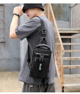 Close-up of black tactical chest bag with waterproof fabric and multi-layer zippers