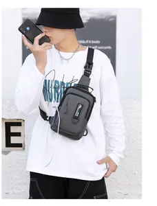 Detail of waterproof men's crossbody bag with headphone port and phone storage
