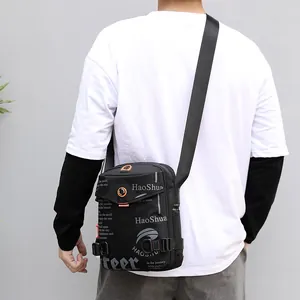 Men's black waterproof crossbody bag with adjustable wide strap in streetwear style