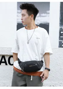 Outdoor sports waist bag in waterproof nylon fabric worn over shoulder by male model