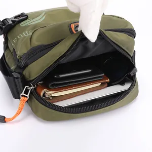 Army green nylon tactical crossbody bag showing spacious interior with daily essentials
