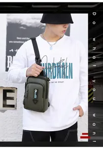 Close-up of military green waterproof crossbody chest bag featuring adjustable strap and buckle