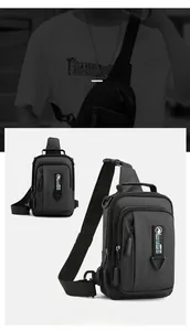 Detail of waterproof black crossbody chest bag featuring sturdy zippers and logo webbing