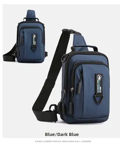 Front view of a deep blue waterproof chest bag with adjustable strap and multiple zippers