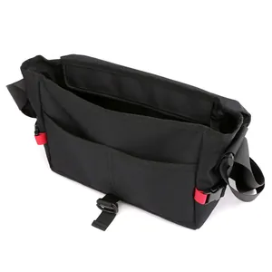 Waterproof black oxford messenger bag with red accents and adjustable shoulder straps