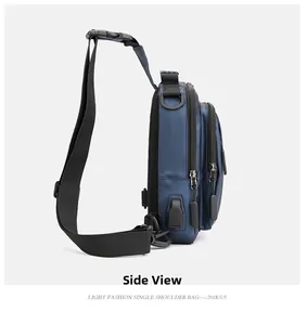 Side view of waterproof navy blue crossbody bag with USB port and multiple zippers