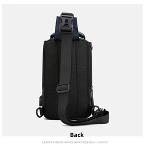 Rear view of navy blue chest bag featuring breathable mesh back and USB charging port