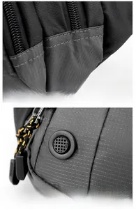 Detail of reinforced stitching and breathable eyelet on waterproof nylon outdoor waist bag
