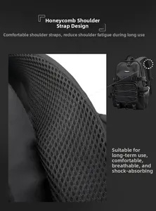 Detail of breathable honeycomb mesh shoulder straps on a black travel backpack for comfort