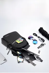 Flat lay showing travel chest bag storage capacity with phone and accessories