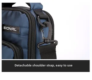 Detail of detachable shoulder strap with rotating hook and durable D-ring on crossbody bag