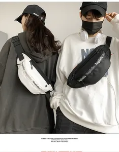 Detail of adjustable branded straps on black and white waterproof street waist bags