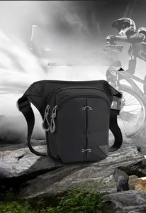 Detail of outdoor multi-pocket leg bag with TOUGH SLHS logo on durable nylon fabric