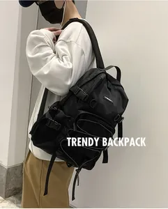 Detailed side view of multi-pocket black nylon backpack with secure straps and buckles
