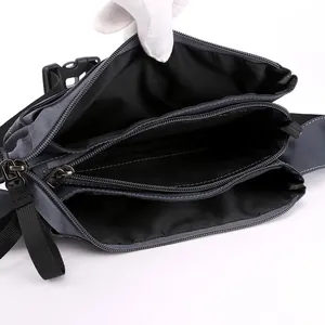 Outdoor sports waist bag in dark grey with multiple zippered compartments and adjustable strap
