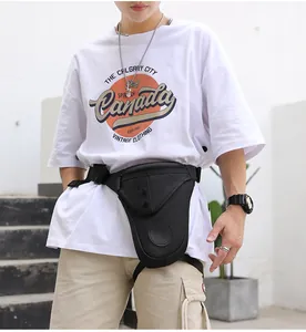 Close-up of black tactical nylon leg bag with quick-release buckles for outdoor cycling