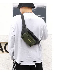 Detail showing durable nylon fabric and HAOSHUAI logo on this tactical olive crossbody bag