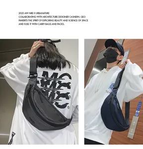 Close-up of black and navy ballistic nylon sling bags for men and women in urban settings