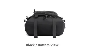 Detailed bottom view of a black tactical backpack showing durable fabric and buckle straps