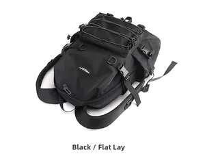 Detailed flat lay of black tactical backpack showing multiple zippers and nylon texture