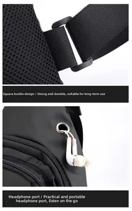 Detail of durable square buckle and earphone port on black tactical chest bag