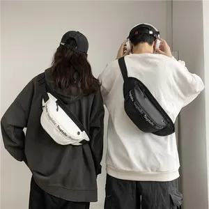 Waterproof crescent waist bags in black and white shown on couple for street style look