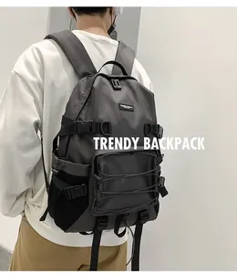 Side view of dark gray functional backpack featuring durable fabric and side mesh pocket