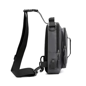 Waterproof dark grey crossbody chest bag with USB charging port and breathable mesh back