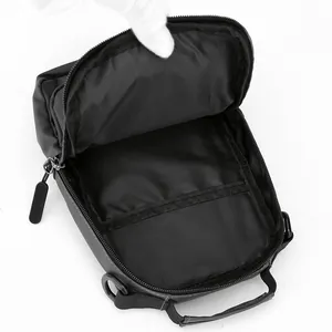 Versatile black waterproof chest bag for men showing internal main compartment and pocket