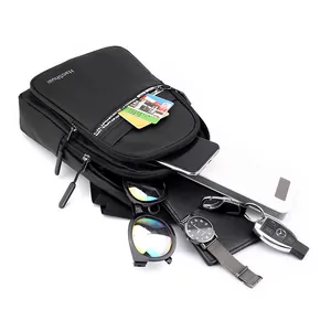 Waterproof black crossbody bag for men showing large capacity for travel essentials