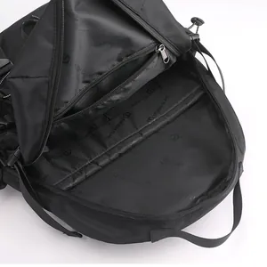 Black travel backpack showing multi-layer internal compartments and zipper storage