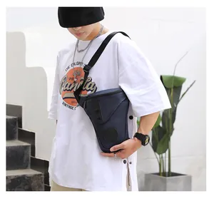 Detail view of deep blue tactical drop leg bag with adjustable straps on outdoor model