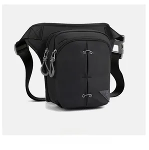 Side view of black tactical leg bag with water-resistant nylon and TOUGH SLING logo