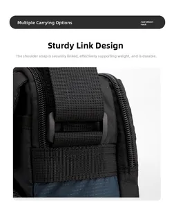 Détail de la connexion de la bandoulière en nylon durable sur un sac à bandoulière noir
