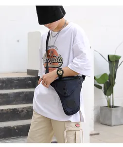 Tactical navy blue drop leg bag with high-density nylon material on workwear pants