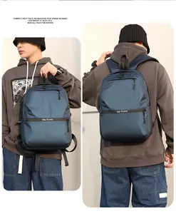 Waterproof business backpack in navy blue shown in hand-held and back-carrying views