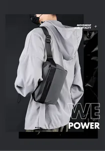 Detailed side view of water-resistant nylon crossbody bag with metallic logo on strap