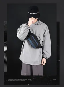 Detail of waterproof men's crossbody chest bag with adjustable strap and logo branding