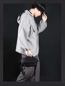 Men's waterproof black chest bag with Love Power slogan shown on a male model