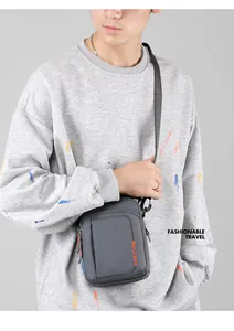 Detailed view of gray waterproof shoulder bag with WEPOWER logo and adjustable strap