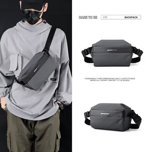 Water-resistant dark grey tactical chest bag with adjustable strap and geometric design