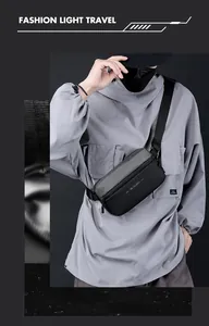 Detail of waterproof nylon crossbody bag with WE POWER text and adjustable strap