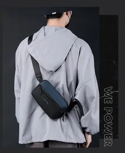 Close-up of minimalist black and navy crossbody chest bag with WE POWER branding