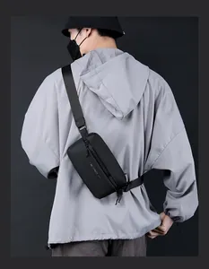 Detailed view of black nylon sling bag featuring WE POWER text and adjustable strap
