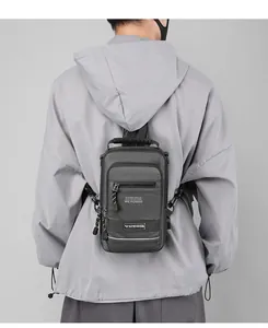 Detail of dark gray tactical chest bag with metal hook and WE POWER print on back