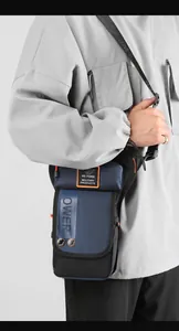 Tactical leg bag with waterproof nylon, orange stitching, and metal buckle details