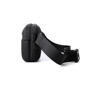 Men's minimalist black nylon crossbody bag with adjustable strap and waterproof pocket