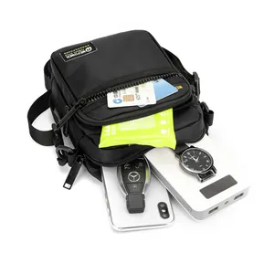 Men's black tactical crossbody bag with multiple zippered pockets and large storage