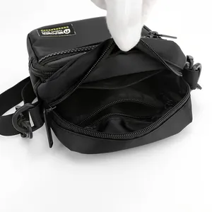 Men's black nylon crossbody bag with multi-layer zipper and internal pockets