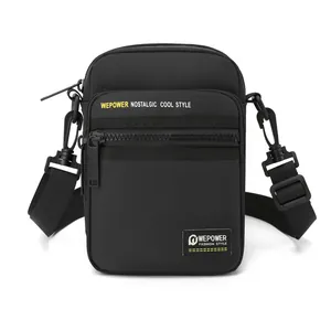 Men's black multi-functional crossbody bag with adjustable strap and front zipper